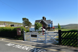 The fence and gate to the station repaired and painted